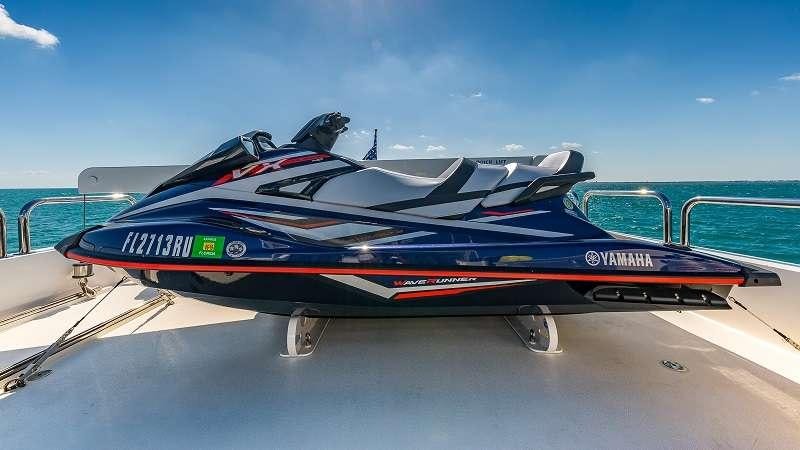 a blue and black boat on a white surface aboard HIGH RISE Yacht for Charter