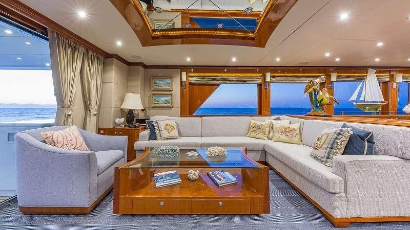 a living room with a large window aboard HIGH RISE Yacht for Charter