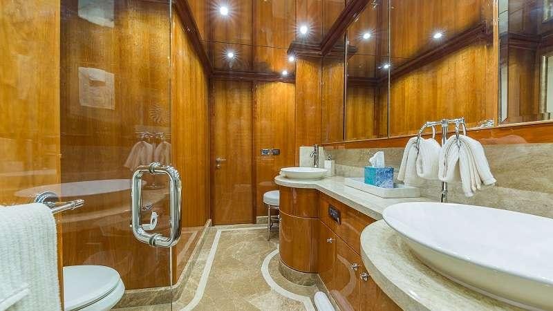 a bathroom with a large tub aboard HIGH RISE Yacht for Charter