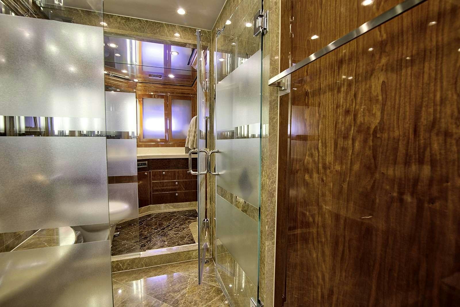 a bathroom with a glass shower aboard STERLING V Yacht for Charter