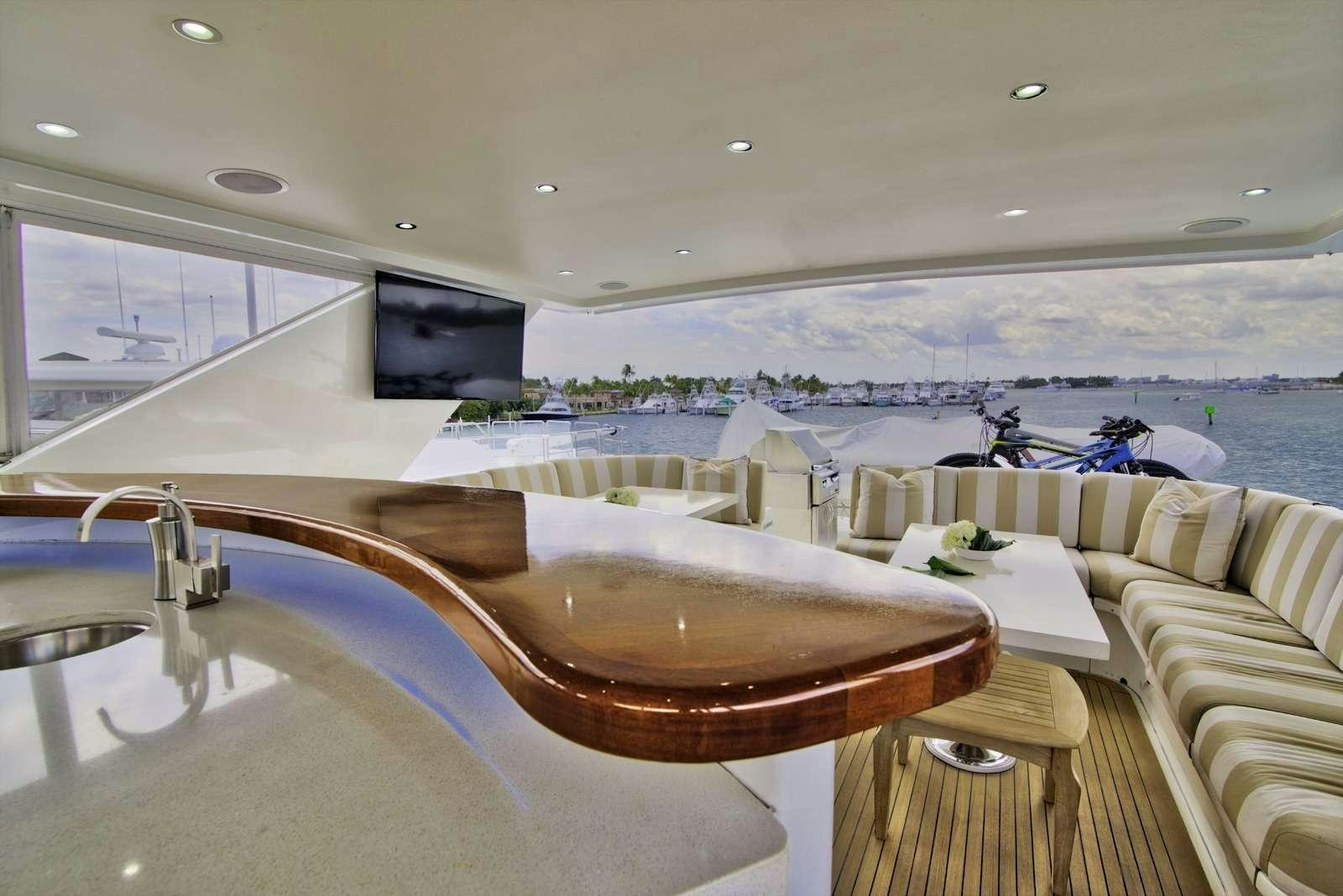 a room with a table and chairs aboard STERLING V Yacht for Charter