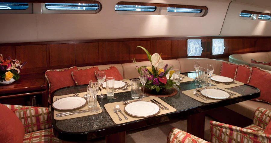 a table with plates and glasses on it aboard SEAQUELL Yacht for Charter