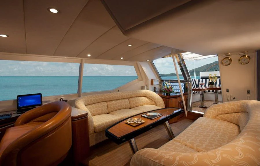 a living room with a large window aboard SEAQUELL Yacht for Charter