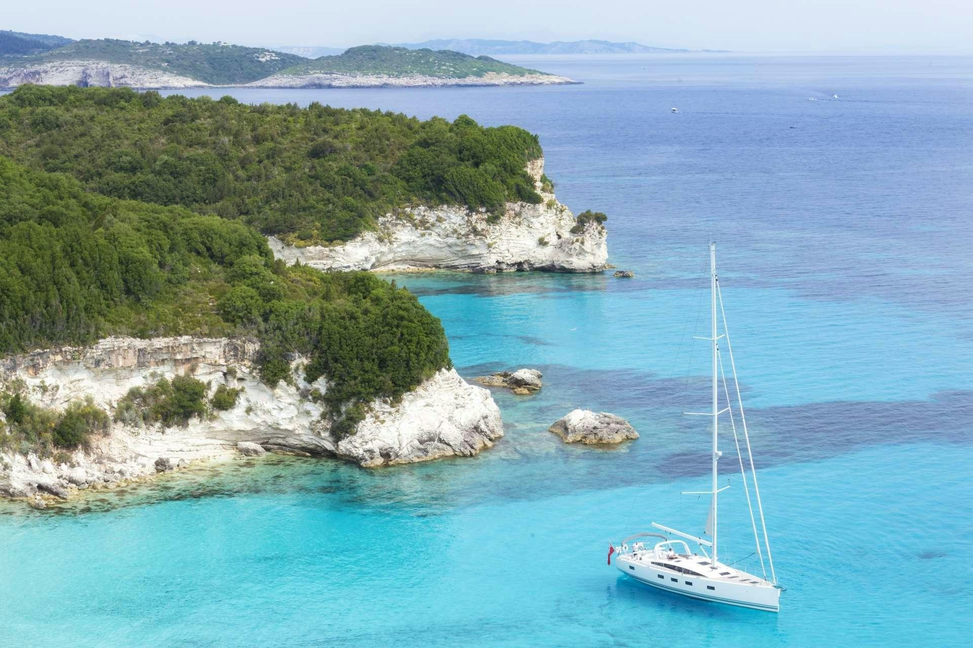 a boat sailing in the sea aboard JEANNEAU 64 Yacht for Charter