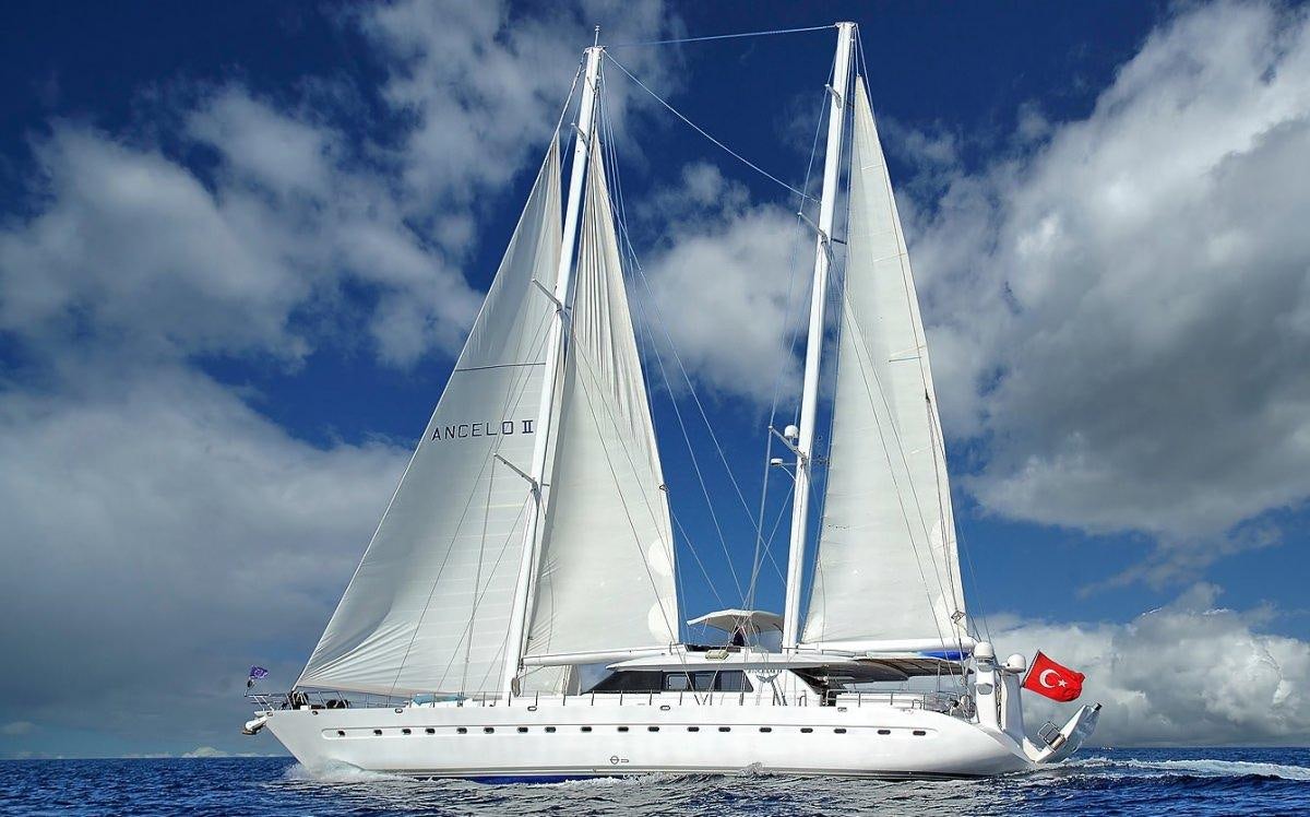 a white boat in the water aboard ANGELO II Yacht for Charter