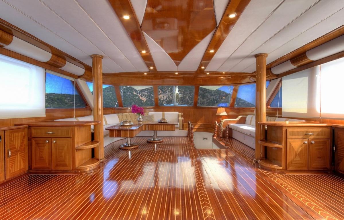 a room with wood floors and a wood floor and a large window aboard ANGELO II Yacht for Charter