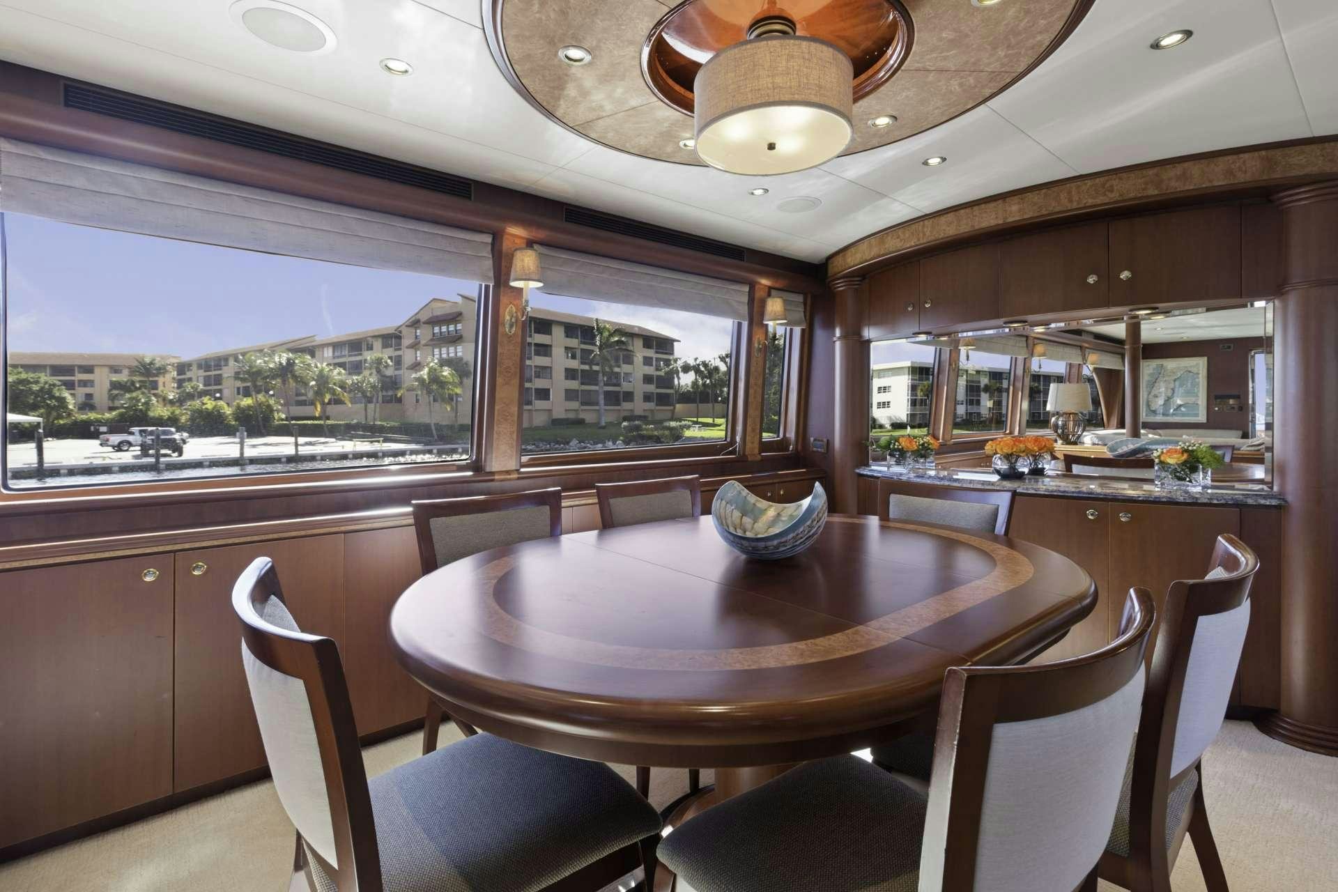 a dining table in a kitchen aboard WINDWARD Yacht for Charter