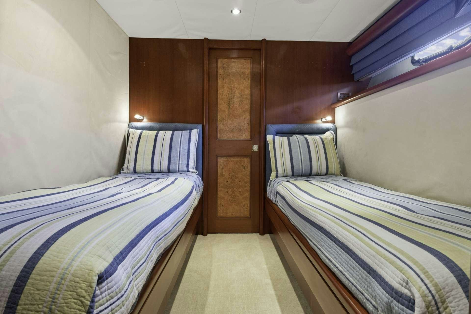 a couple of beds in a room aboard WINDWARD Yacht for Charter