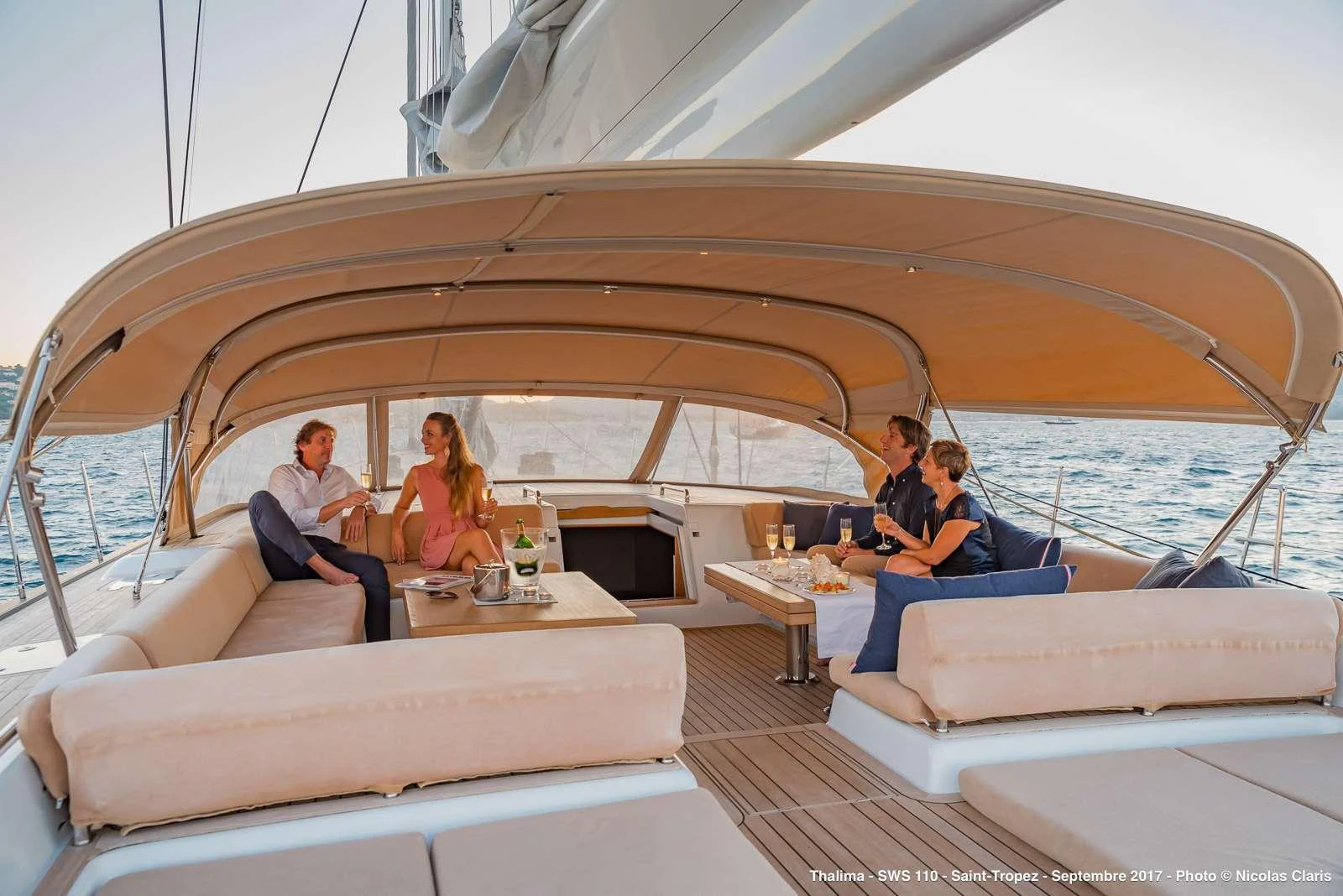 a group of people sitting on a boat aboard THALIMA Yacht for Charter