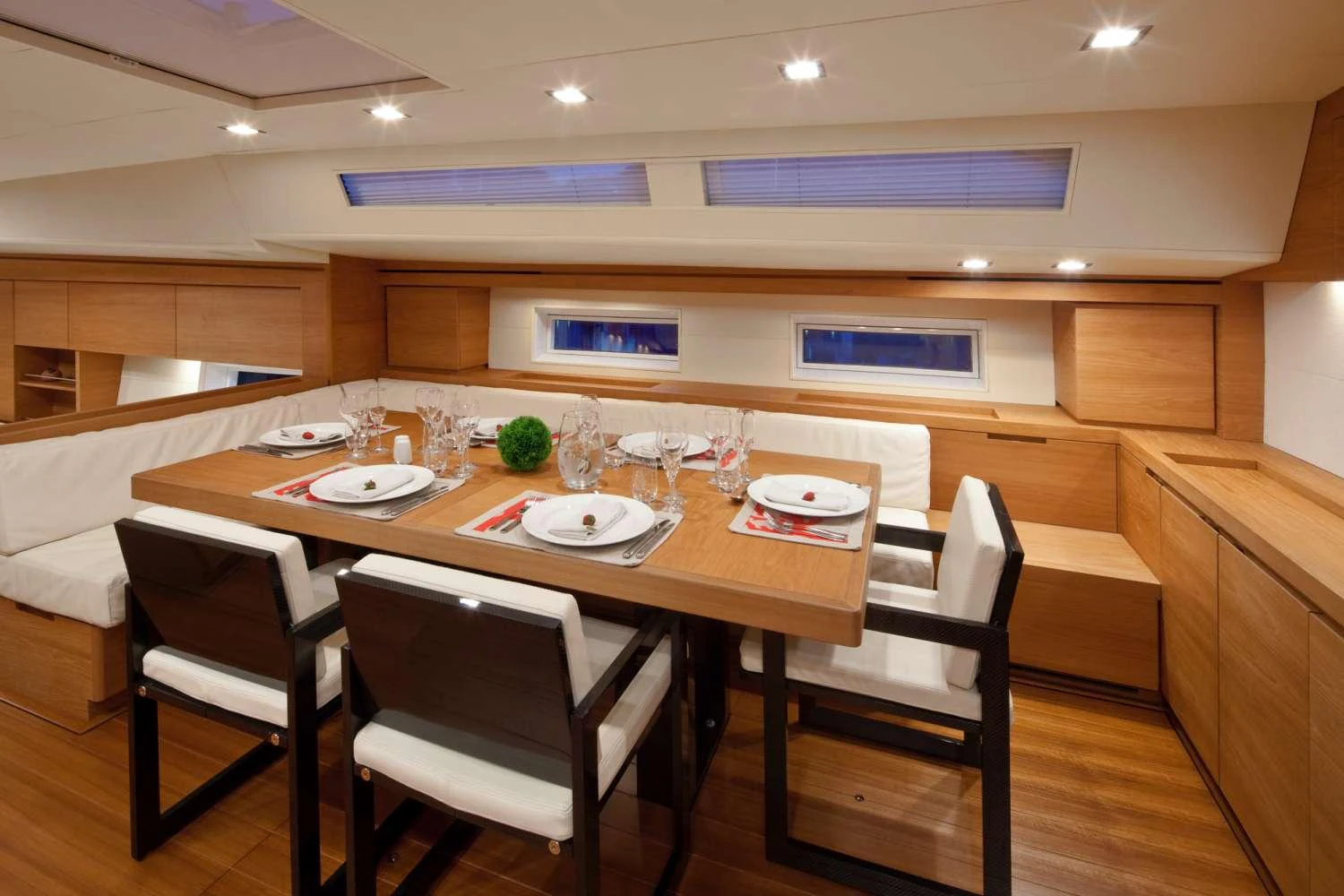 a table with plates and glasses on it aboard THALIMA Yacht for Charter