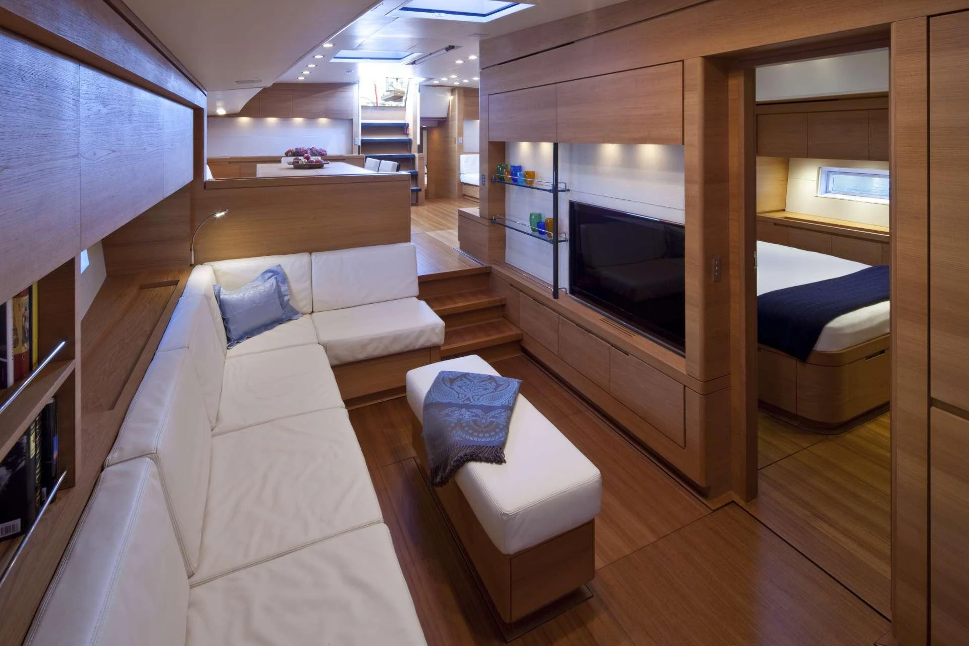 a room with a couch and a tv aboard THALIMA Yacht for Charter