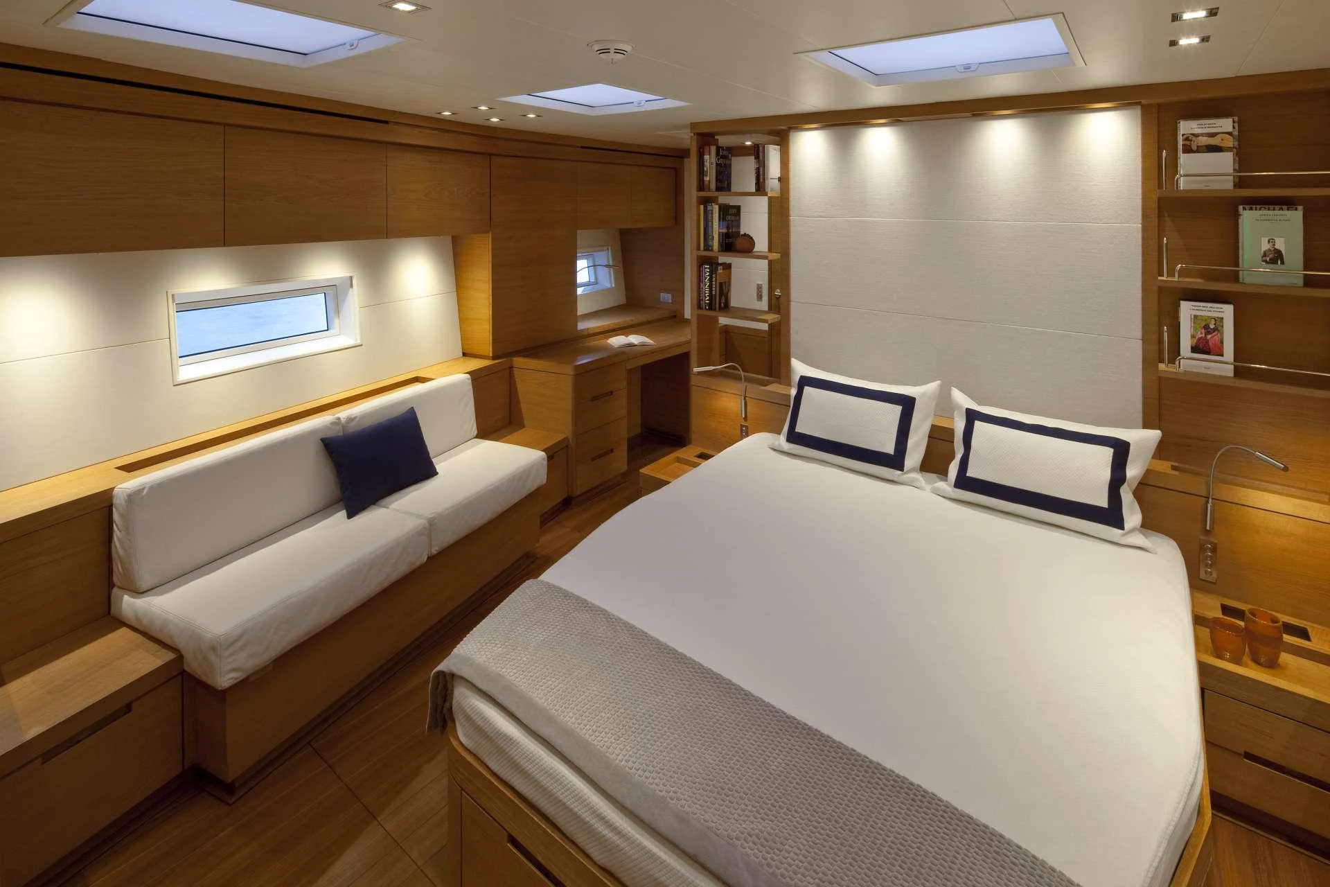 a room with a bed and a couch aboard THALIMA Yacht for Charter