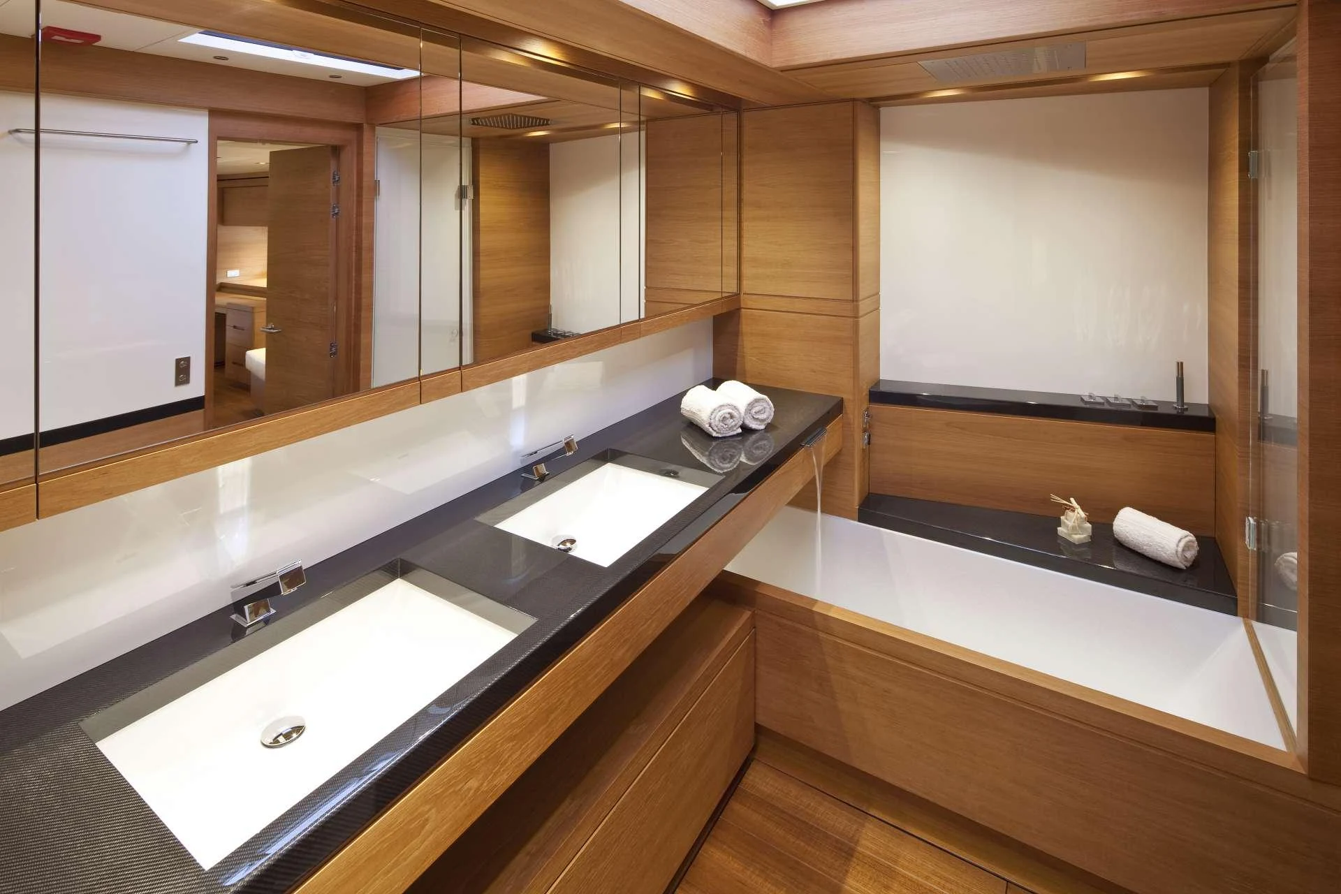 a bathroom with a large mirror aboard THALIMA Yacht for Charter