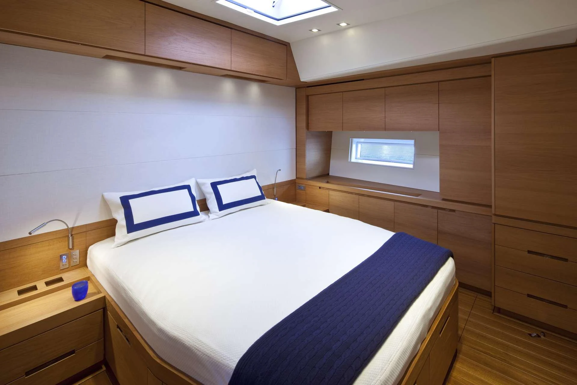 a room with a bed and a desk aboard THALIMA Yacht for Charter