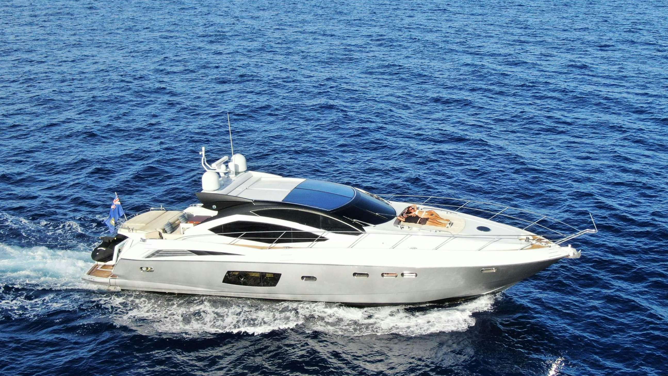 a white yacht in the water aboard ALMA Yacht for Charter