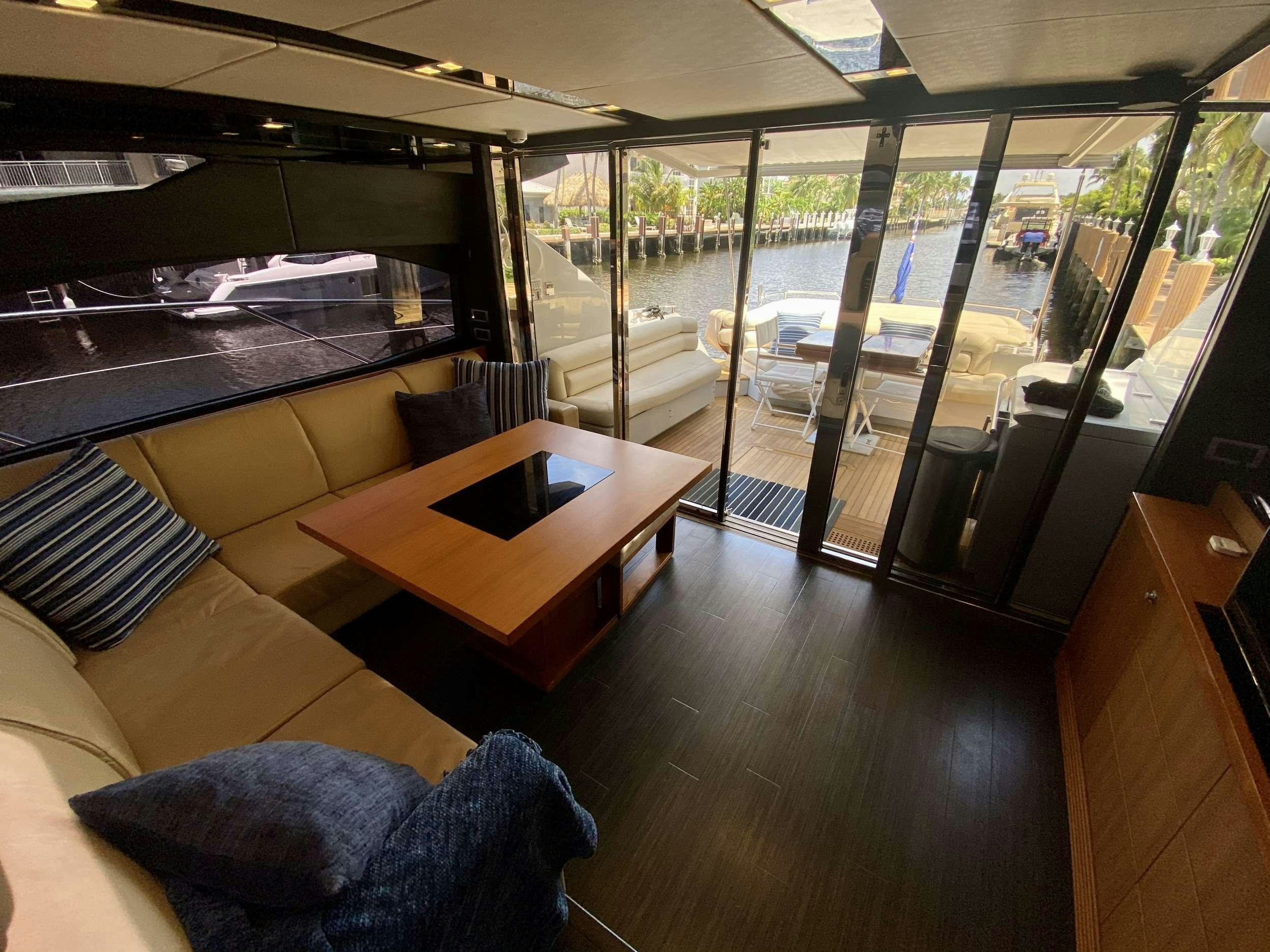 a room with a table and chairs aboard ALMA Yacht for Charter