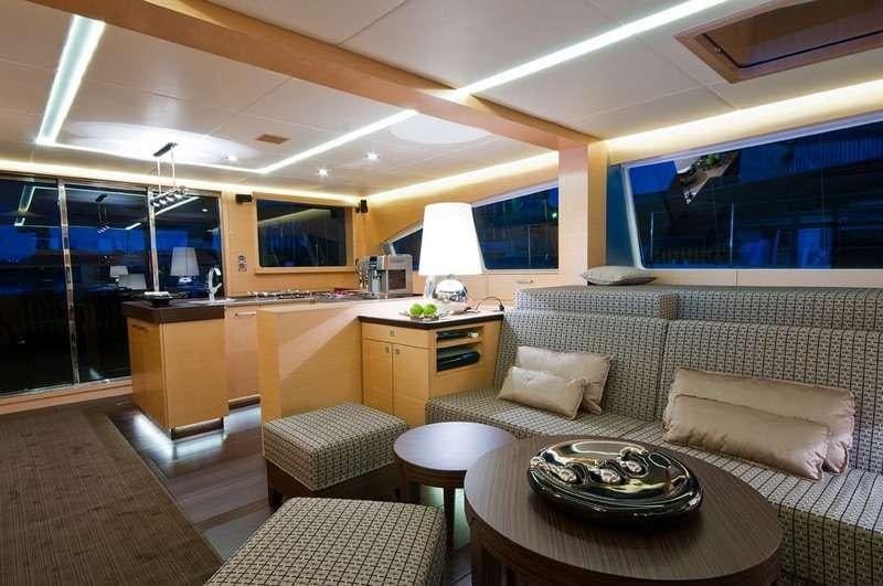a living room with a couch and a table aboard IPHARRA Yacht for Charter