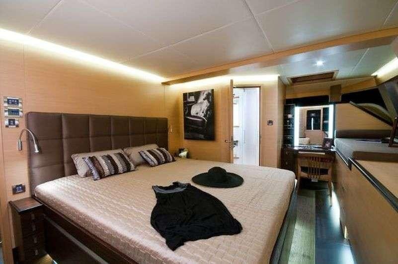 a bed in a room aboard IPHARRA Yacht for Charter