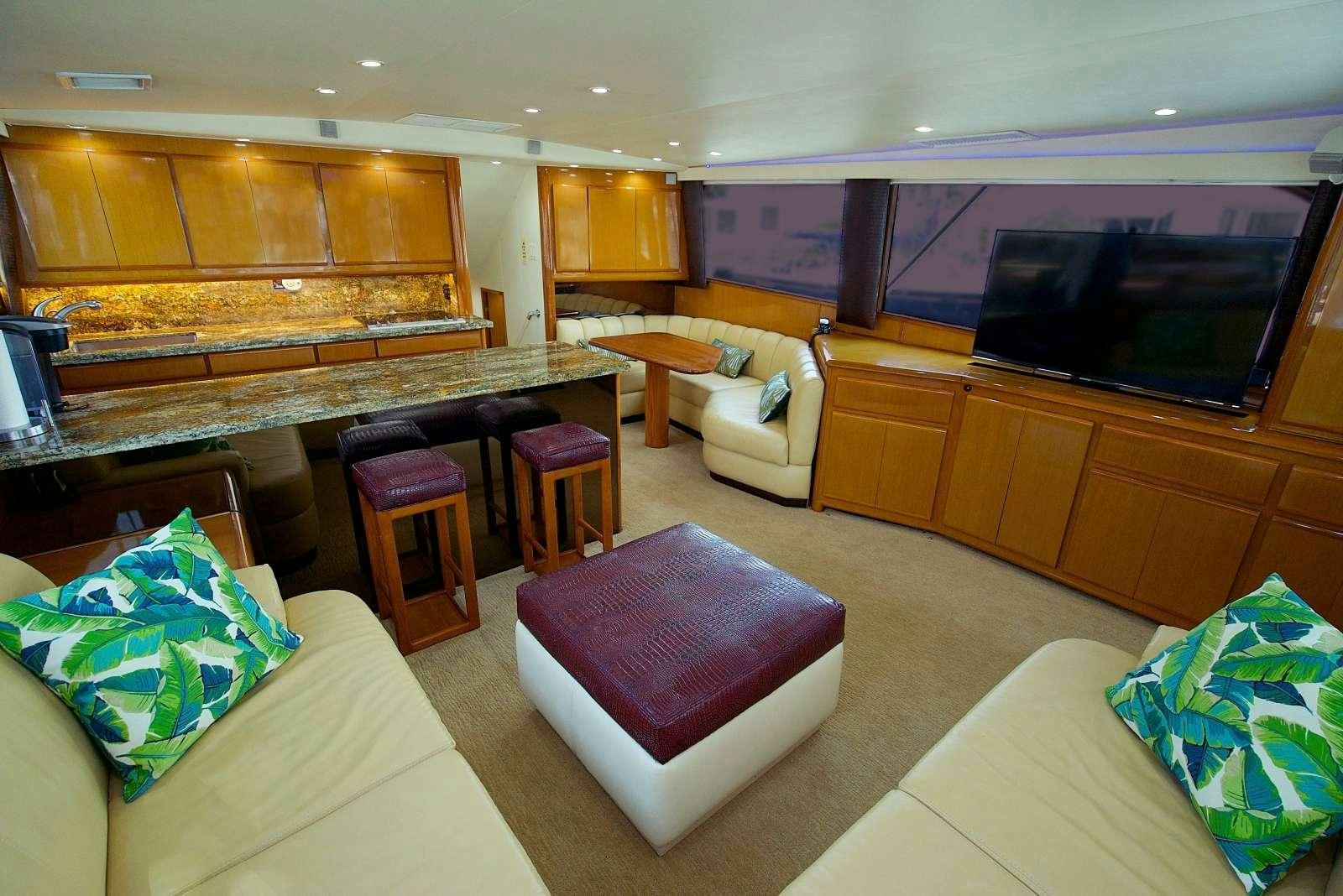 a room with a couch and a tv aboard MISS KETHLEEN Yacht for Charter