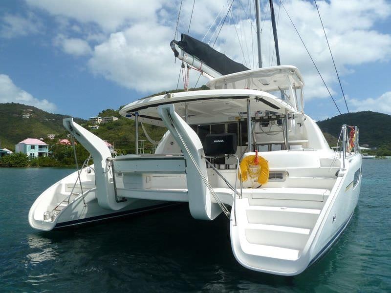 a white boat in the water aboard ISLAND R&amp;R Yacht for Charter