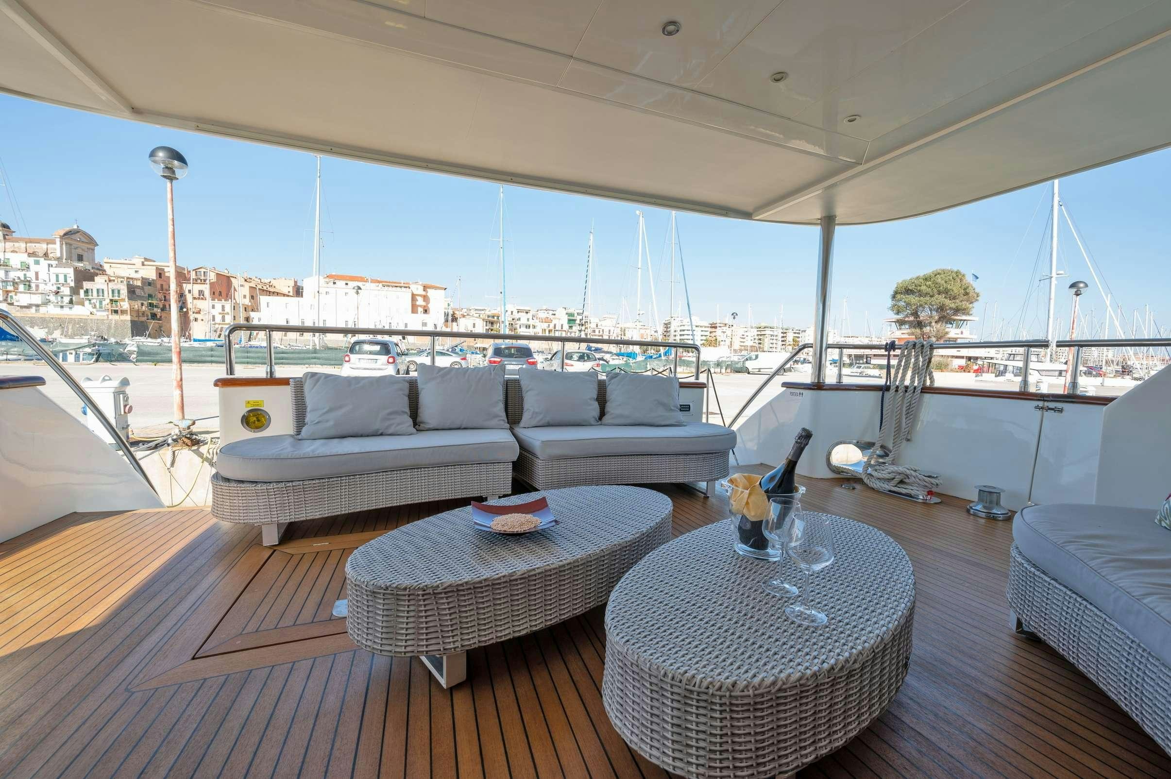 a large living room with a large balcony aboard FIRST LADY II Yacht for Charter