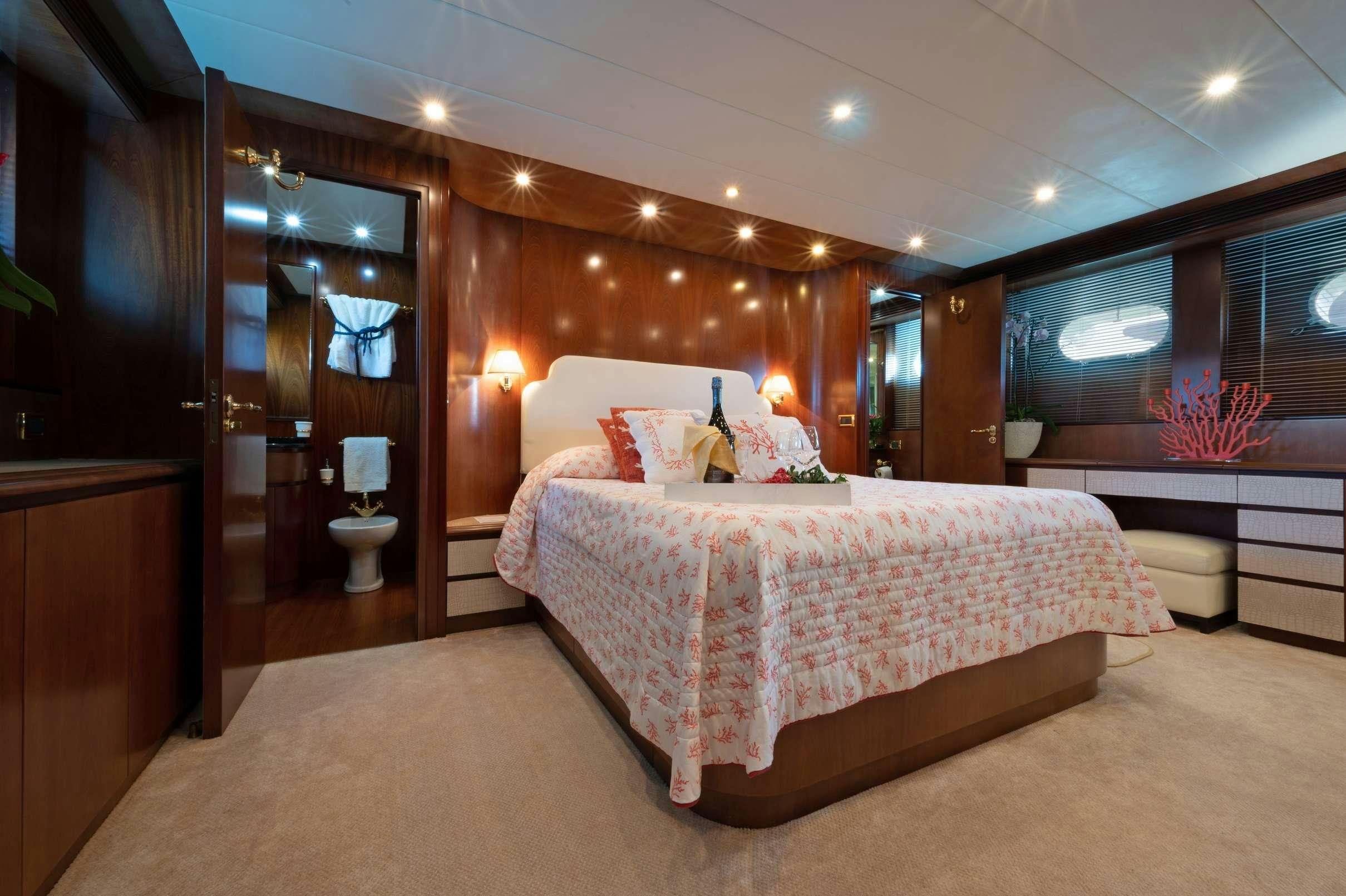 a large bedroom with a large bed aboard FIRST LADY II Yacht for Charter