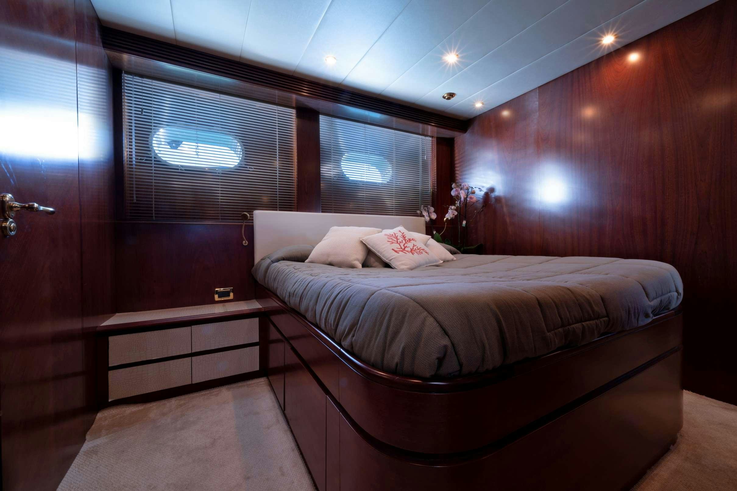 a bed in a room aboard FIRST LADY II Yacht for Charter