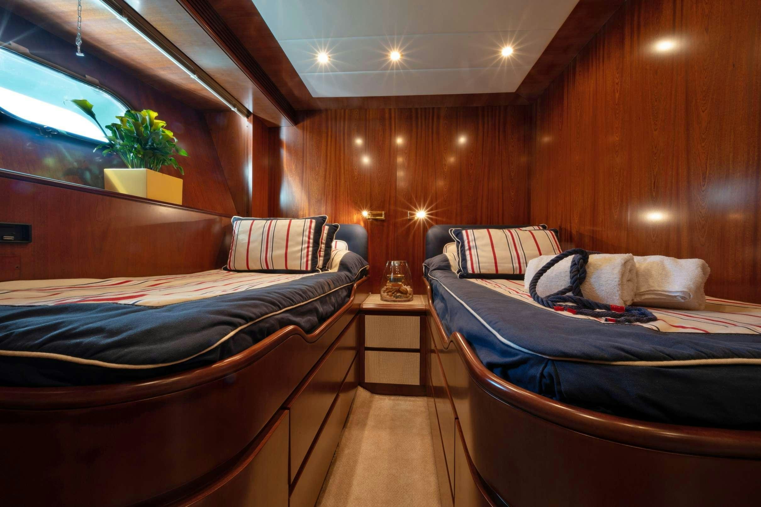 a room with two beds aboard FIRST LADY II Yacht for Charter