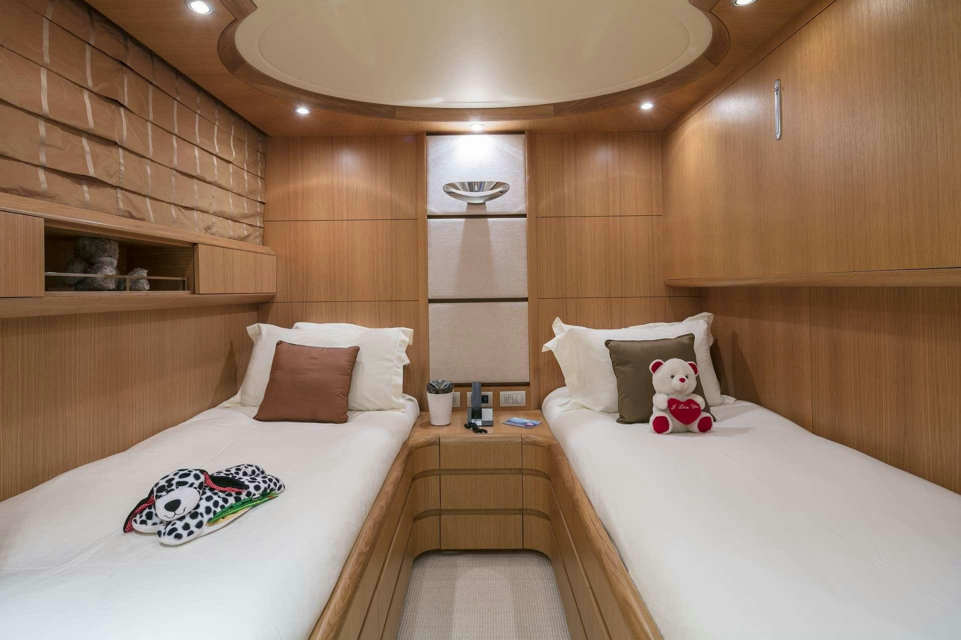 a room with two beds aboard ANASA Yacht for Charter