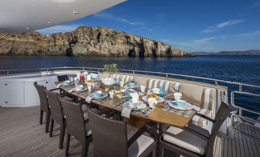 a table set for a meal on a boat aboard ANASA Yacht for Charter