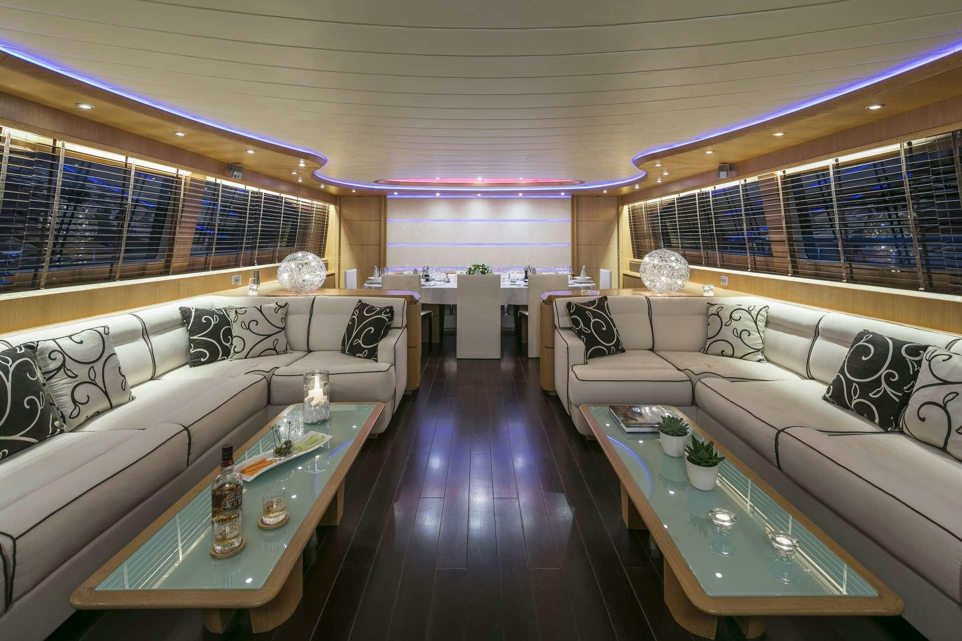 a living room with a large window aboard ANASA Yacht for Charter