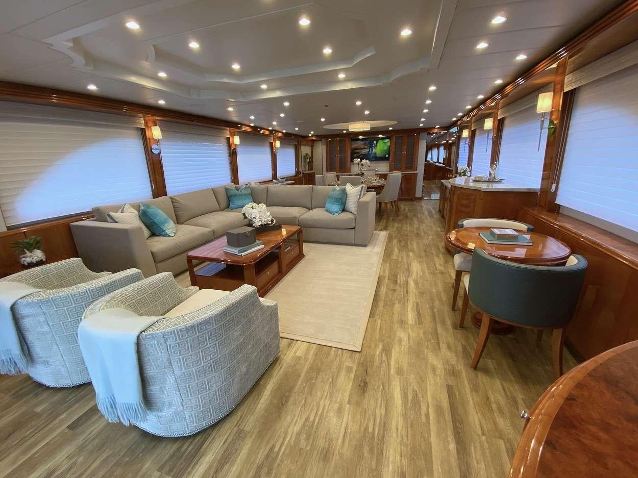 a living room with a large window aboard BRANDI WINE Yacht for Charter