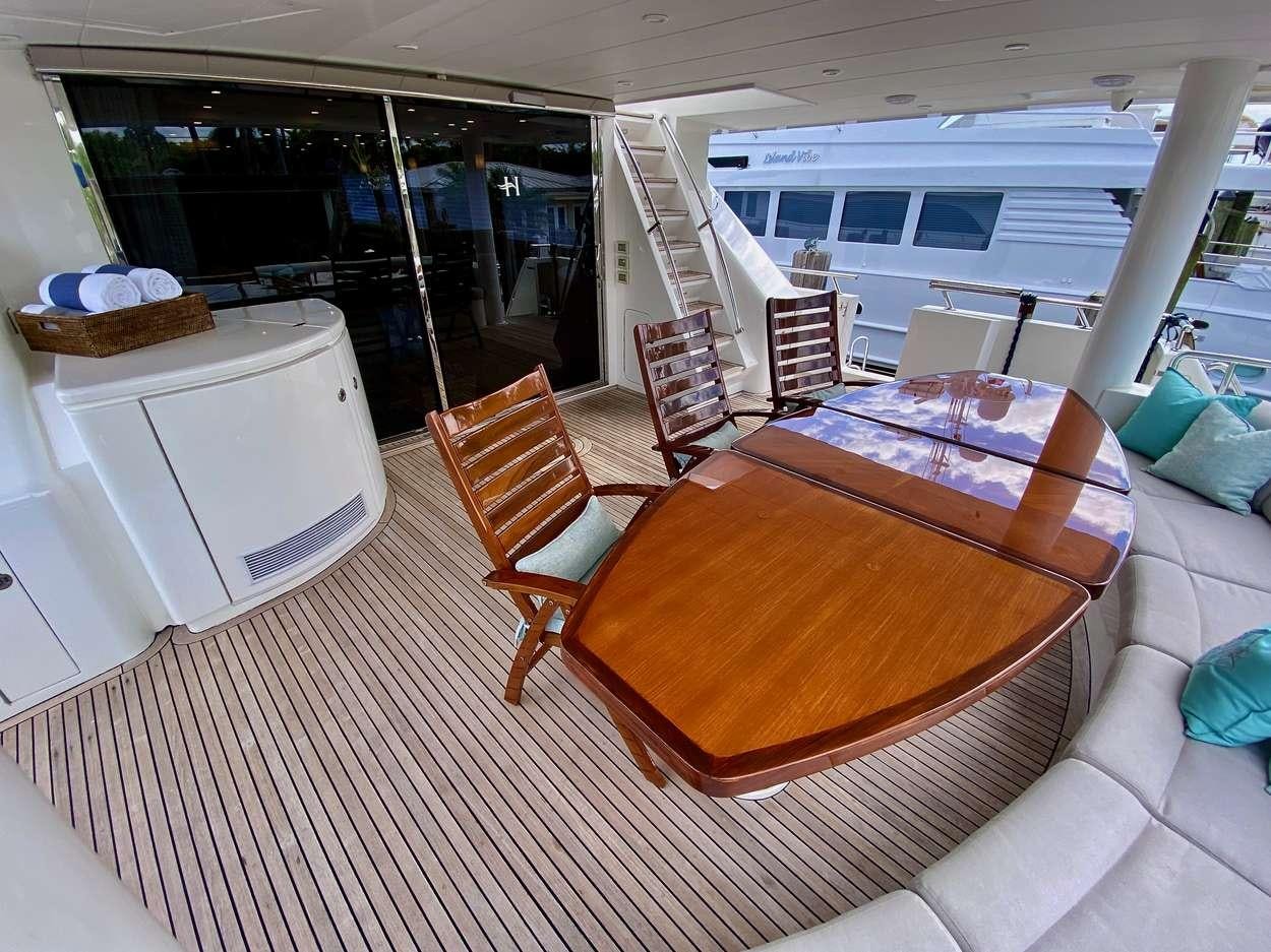 a room with a table and chairs aboard BRANDI WINE Yacht for Charter
