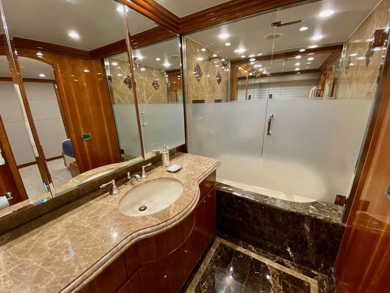 a bathroom with a marble countertop aboard BRANDI WINE Yacht for Charter