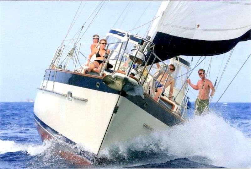 a group of men on a sailboat aboard JALAPE&Ntilde;O Yacht for Charter