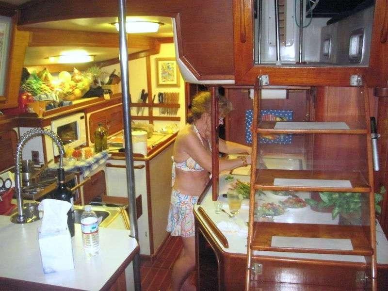 a person standing in a kitchen aboard JALAPE&Ntilde;O Yacht for Charter