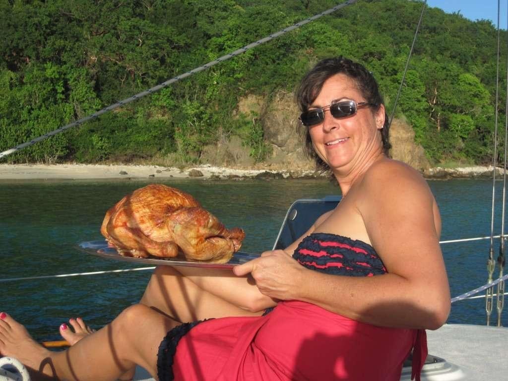 a person holding a pizza aboard JALAPE&Ntilde;O Yacht for Charter