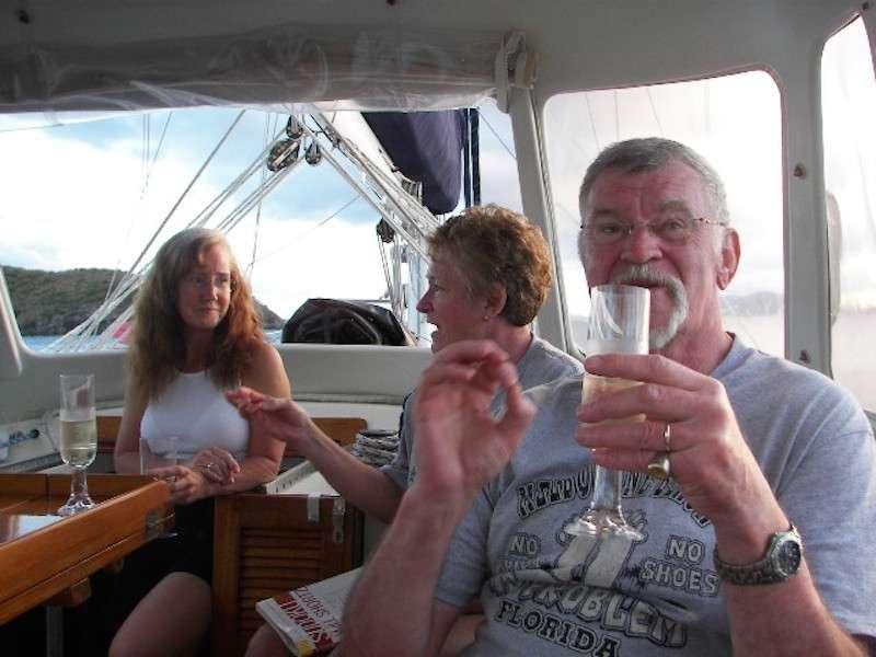 a person holding a glass of wine aboard JALAPE&Ntilde;O Yacht for Charter