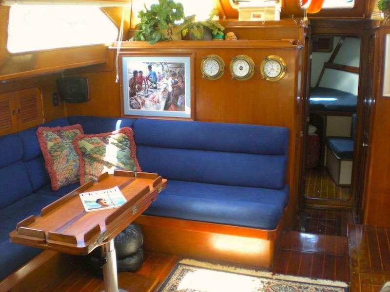 a blue couch in a room aboard JALAPE&Ntilde;O Yacht for Charter