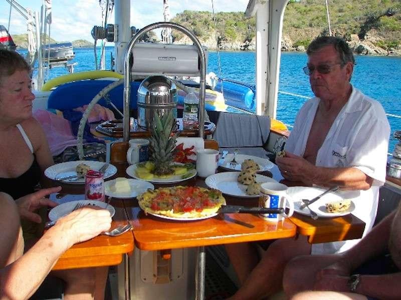 people sitting at a table with food aboard JALAPE&Ntilde;O Yacht for Charter