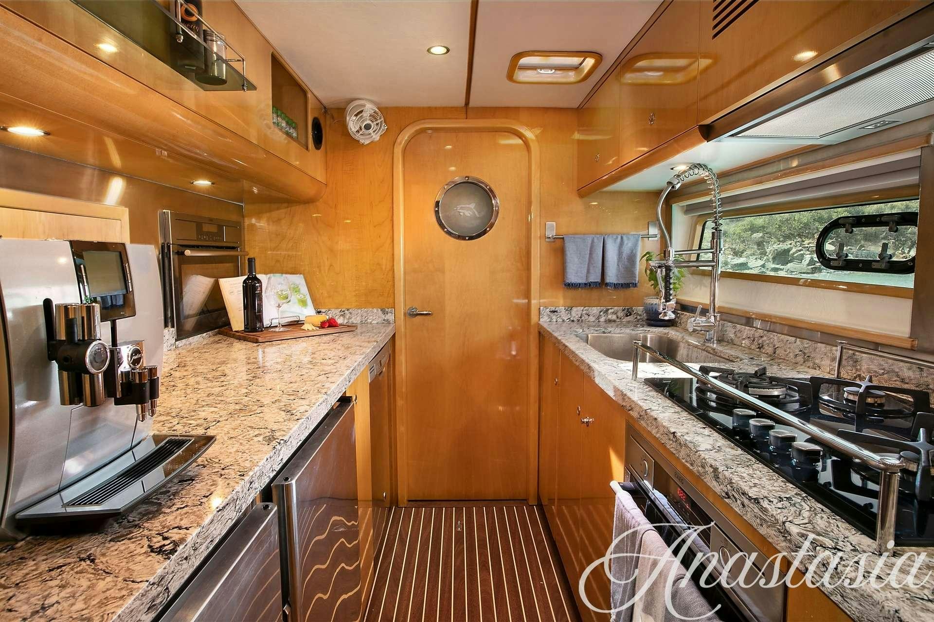 a kitchen with a large countertop aboard ANASTASIA Yacht for Charter