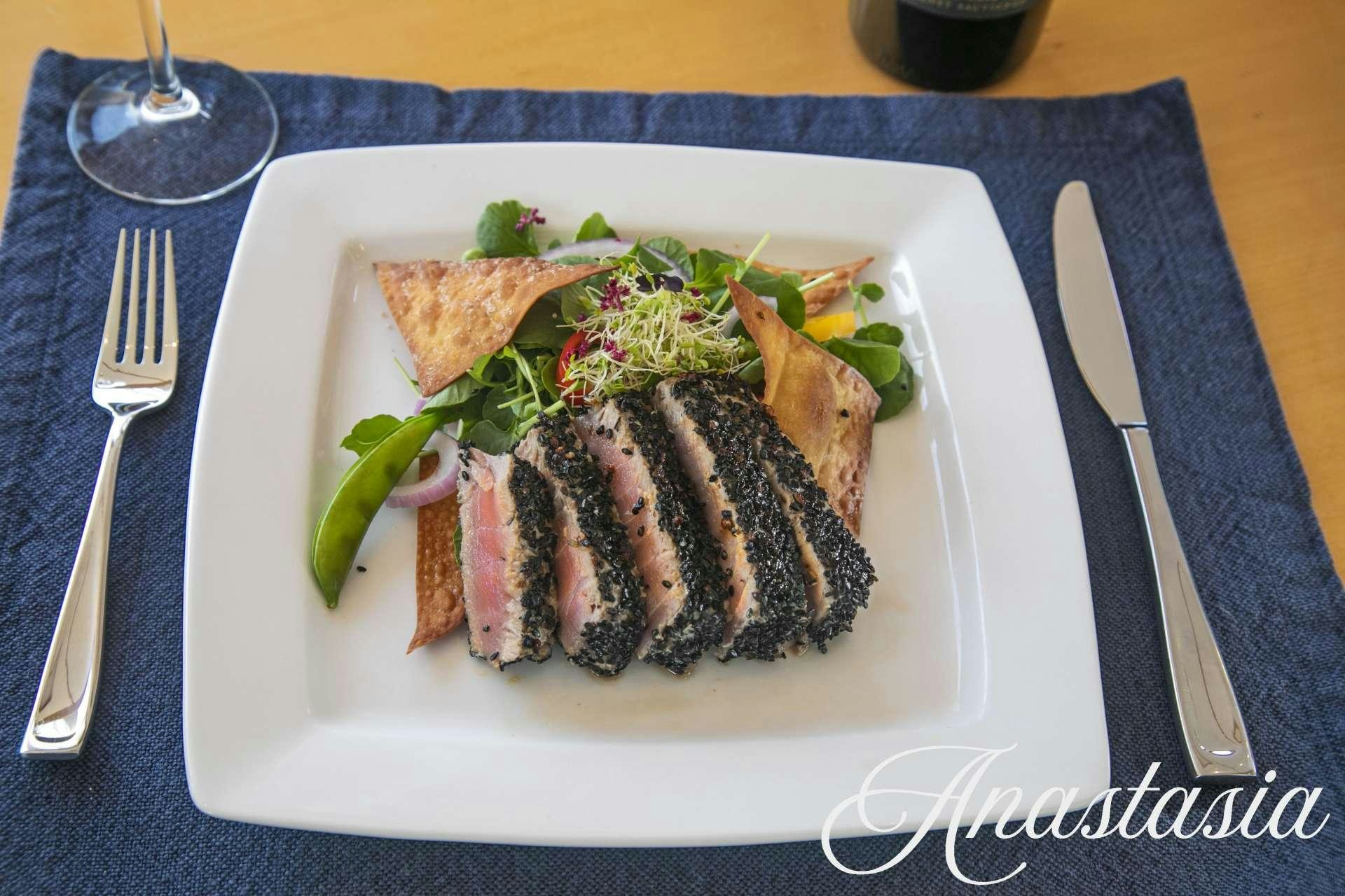 a table with plates and glasses on it aboard ANASTASIA Yacht for Charter