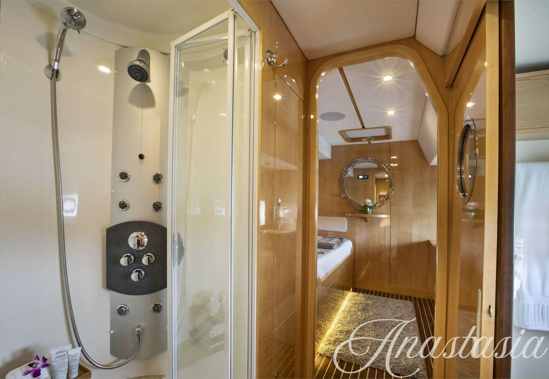 a bathroom with a shower unit aboard ANASTASIA Yacht for Charter