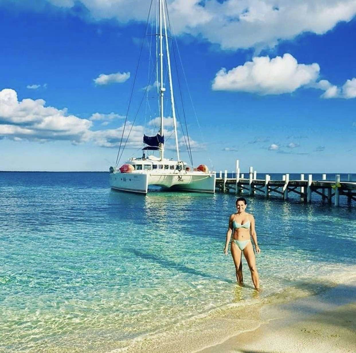 a person standing in the water aboard DORIS Yacht for Charter