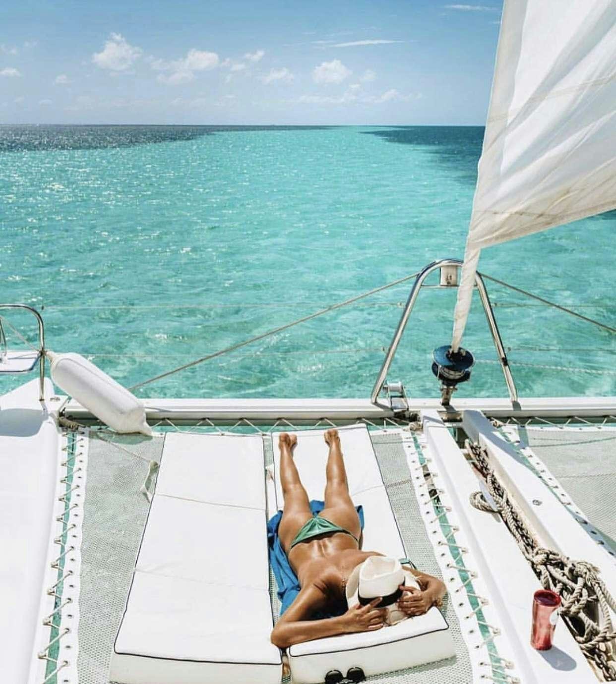 a person on a boat aboard DORIS Yacht for Charter