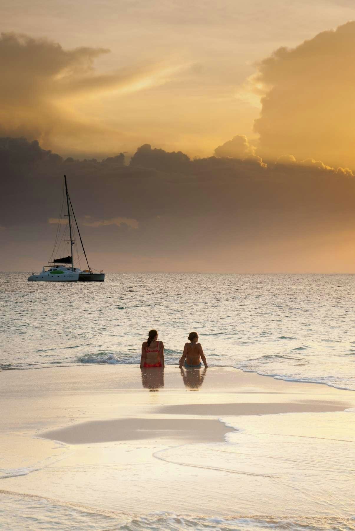 a couple of people in the water aboard DORIS Yacht for Charter