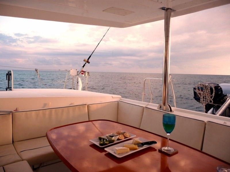 a table with food and drinks on it aboard DORIS Yacht for Charter