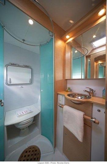 a bathroom with a sink and a toilet aboard DORIS Yacht for Charter
