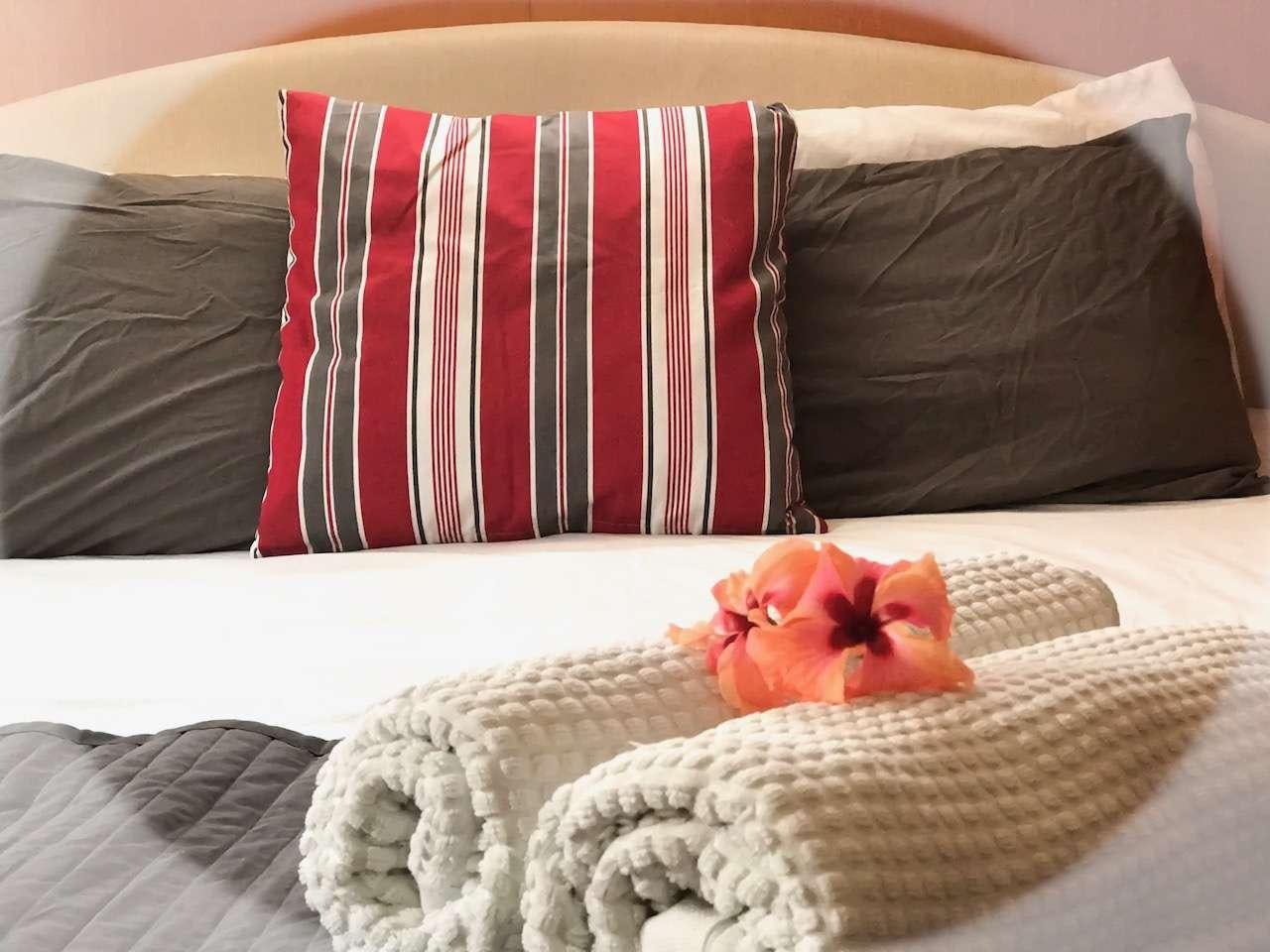 a pillow on a bed aboard DORIS Yacht for Charter