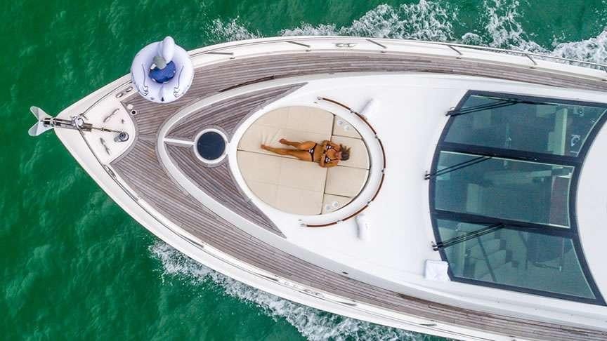 a white car with a round dial and a round dial on the front aboard LADY H Yacht for Charter